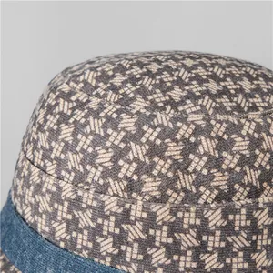 Detail shot of winter bucket hat showing houndstooth texture and blue denim brim