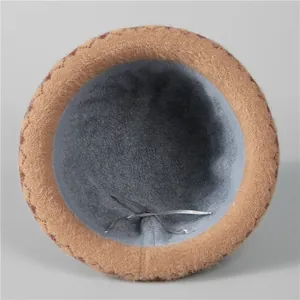 Close-up of warm winter hat with plush khaki exterior and soft fleece lining detail