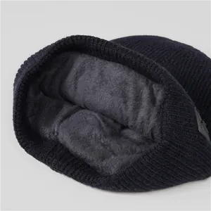 Detail of winter knit hat featuring thick grey fleece lining and ribbed texture for men