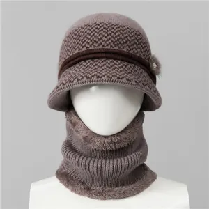 Detailed knit texture of elderly women's winter hat with faux fur trim and pearl detail