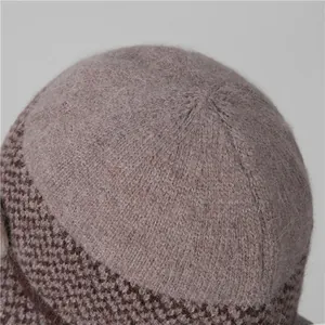 Close-up of thick knitted winter hat showing warm mohair texture and bicolour pattern