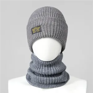 Detailed macro view of dark grey thick knit balaclava hat with vertical ribbed texture