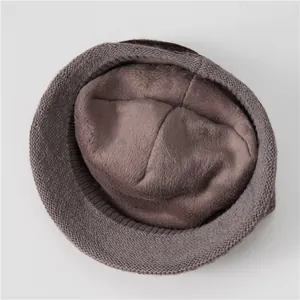 Close-up of thick fleece lining and knitted texture on elderly women winter hat