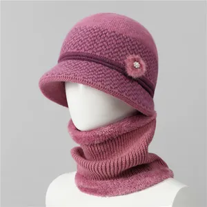 Detail of elderly women's winter knit hat and neck warmer with faux fur trim