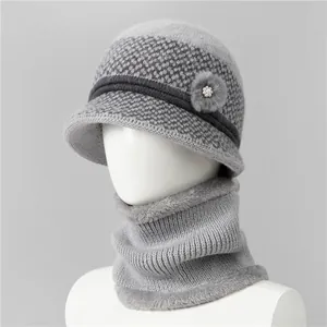 Close-up of winter knit hat with neck warmer set featuring gray faux fur lining and pearls
