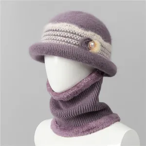 Close-up of purple knit hat and neck warmer set with pearl rhinestone flower detail
