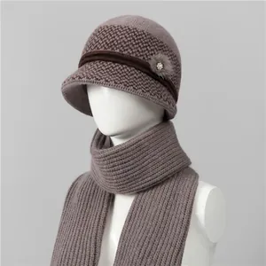 Detail of winter knit hat and scarf set for elderly women with houndstooth pattern