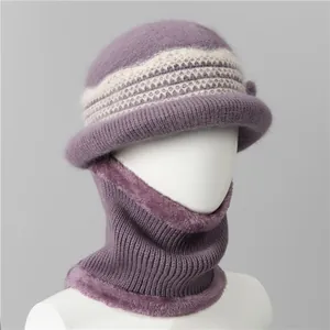 Detail view of purple knit hat and neck warmer with thick faux fur lining for elderly women