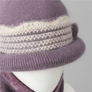 Detailed view of women's purple knitted winter hat and scarf set with fleece lining