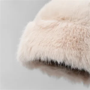 Plush faux fur bucket hat in cream white color for winter outdoor warmth and fashion