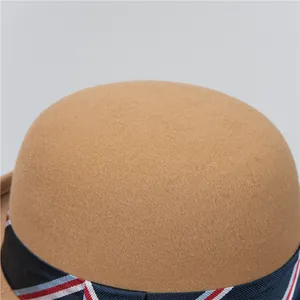 Vintage camel wool felt bowler hat for women with a decorative striped ribbon band