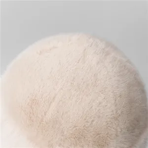 Close-up of the soft beige faux fur texture on this winter Mongolian style bucket hat