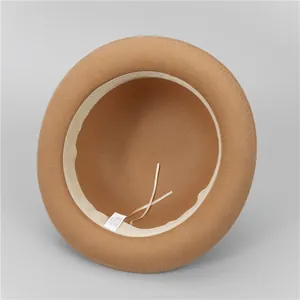 Detail view of khaki wool blend felt hat interior with size adjustment string and wash label