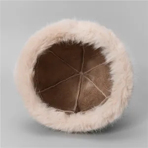 Pink plush Mongolian style winter hat with warm faux suede lining and thick fur texture