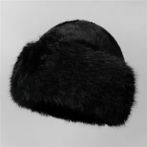 Close-up of the fluffy texture and thick faux fur fabric of this black winter hat
