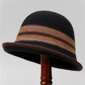Detail of striped knitted bucket hat with rolled edge and warm winter wool texture