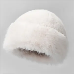 Detail view of the soft white plush faux fur texture on the warm Mongolian bucket hat