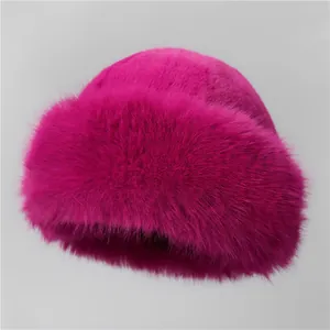 Detailed close-up of fluffy fuchsia faux fur winter hat showcasing its soft texture