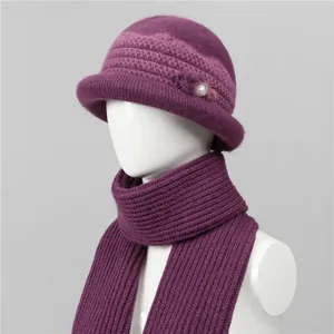 Detail of purple knit hat set for elderly women with flower pearls and thick scarf texture