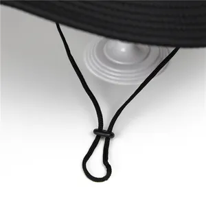 Detail of adjustable drawstring and reinforced stitching on black outdoor sun hat