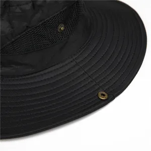 Black outdoor sun hat with wide brim, mesh vents and metal snap buttons for fishing