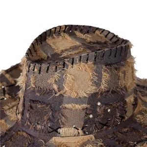 Macro detail of retro patchwork cowboy hat with distressed edges and stitching