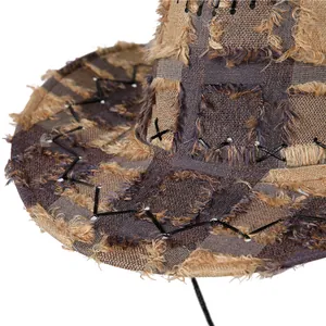Macro shot of vintage Western denim hat featuring plaid fabric with frayed edge details