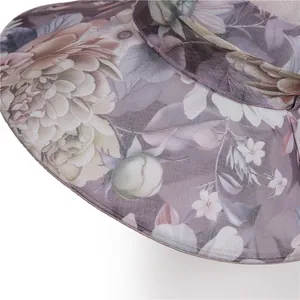 Elegant wide brim lavender sun hat for women featuring floral mesh and bow detail