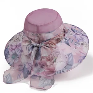Detail of elegant lilac sun hat with floral mesh brim and decorative bow tie