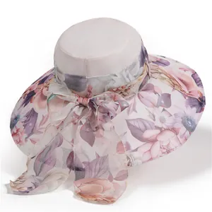 Detail shot of lightweight sun hat with elegant floral bow and wide brim design