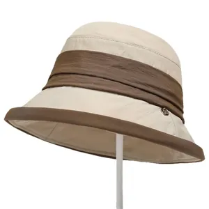 Elegant French beige sun hat with brown pleated ribbon and wide brim for women