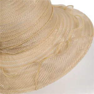 Detailed macro view of sheer organza mesh texture and wavy pleated brim on sun hat