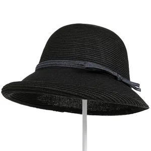 Detail of black woven sun hat with vintage cloche style and gray bow ribbon detail