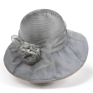 Detailed view of elegant grey organza sun hat with large floral and bow decoration