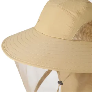 Detailed close-up of khaki outdoor sun hat with mosquito mesh net and breathable vent holes