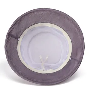 Detail of purple sun hat showing breathable white mesh lining and adjustable drawstrings