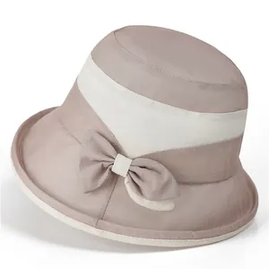 Detail of elegant sun hat for elderly women with chic bow and breathable woven texture