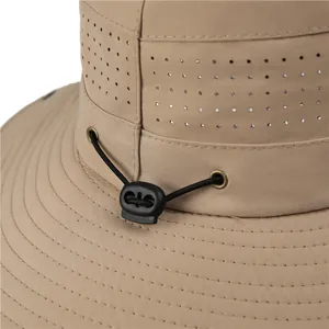 Detailed view of khaki hiking hat featuring breathable mesh vents and adjustable drawstring