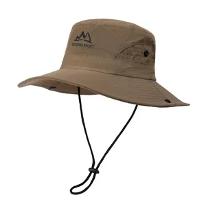 Detail view of coffee-colored outdoor sun hat with breathable mesh and mountain graphic print
