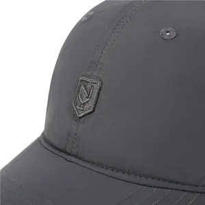 Detail of dark grey quick-dry baseball cap with high-quality shield embroidery