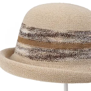 Detail of breathable knitted sun hat with colorful retro stripes and rolled edge