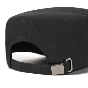 Detailed view of the adjustable cotton strap and metal buckle on a black flat top military cap