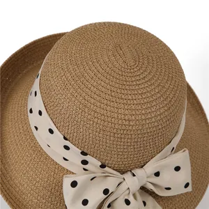 French straw sun hat with chic polka dot ribbon bow for summer beach vacation uv protection
