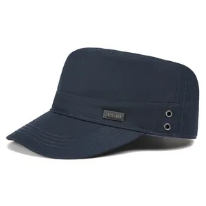 Detail of navy blue cotton cadet cap with metal brand plate and breathable eyelets