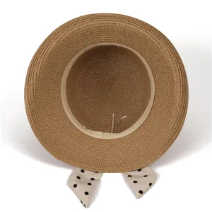 French style brown straw sun hat with black polka dot bow and inner adjustable strap