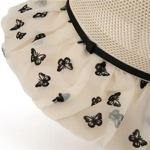 Women's mesh sun hat with wide brim, butterfly embroidery, and beige woven texture