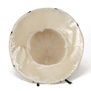 Breathable mesh sun hat for women with wide brim and elegant black bow detail in beige