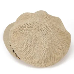 Beige knitted newsboy hat with hollow octagonal pattern and vintage metal rivet decor