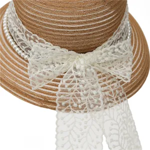 French straw hat with white lace bow and pearl chain decoration for sun protection
