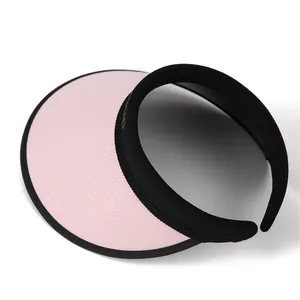 Women's light pink open top sun hat with large UV protection brim and black headband
